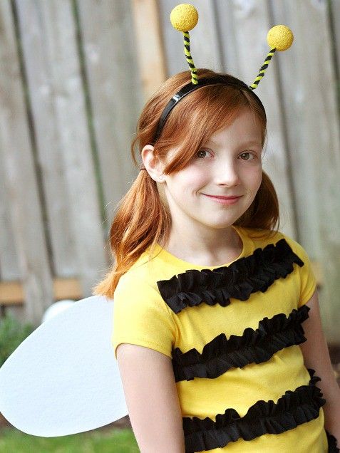 little girl wearing bumble bee costume