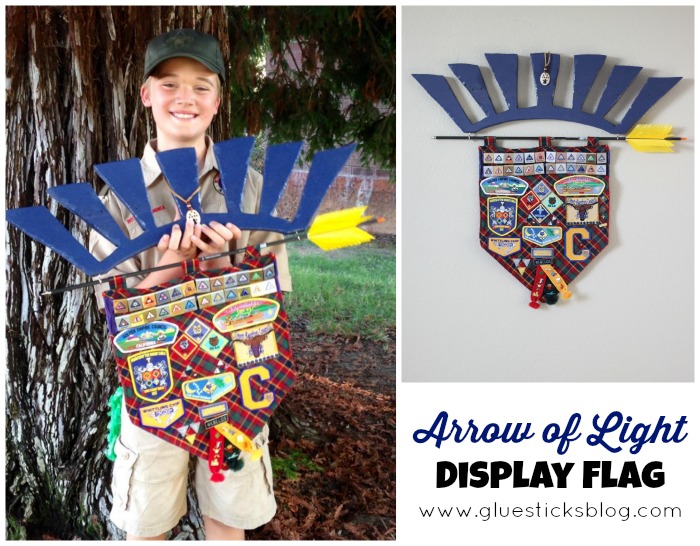 boy holding arrow of light display