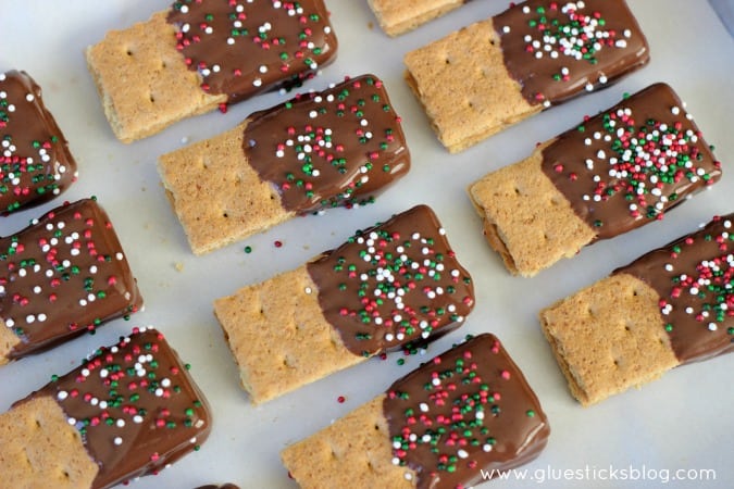 These chocolate dipped peanut butter graham crackers are just about the easiest dessert that you can make, but they are a FAVORITE over here! Sometimes we'll use other crackers like Club or Ritz, but the result is always the same. Delish!