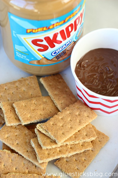 These chocolate dipped peanut butter graham crackers are just about the easiest dessert that you can make, but they are a FAVORITE over here! Sometimes we'll use other crackers like Club or Ritz, but the result is always the same. Delish!