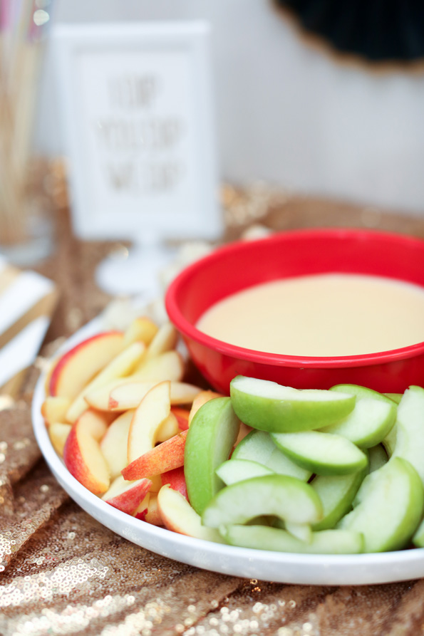 apple slices on platter with cheese fondue