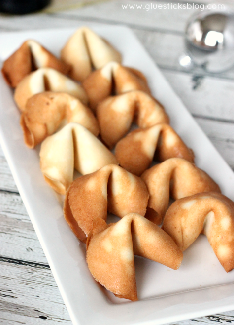 homemade fortune cookies on white serving platter