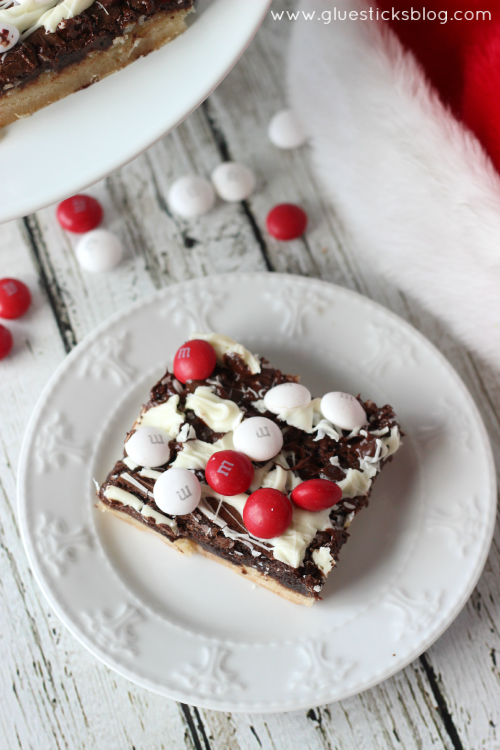 These black and white peppermint brownies combine a sugar cookie, brownie,two types of chocolate, and M&Ms White Chocolate Peppermint Candies. Absolutely beautiful and perfect to give to friends this holiday season!