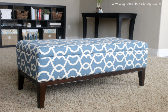 These step by step photos will show you how to reupholster a storage ottoman the quick and easy way! Breathe new life into an old ottoman with new fabric! This two hour project is great for beginners.