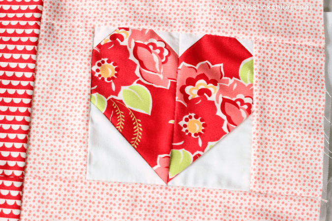 How to make quick and easy heart quilt squares! Stitch 4 together to make darling Valentine's day throw pillows!