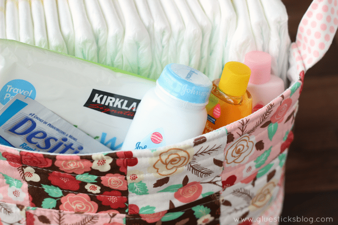 baby powder and shampoo in fabric basket