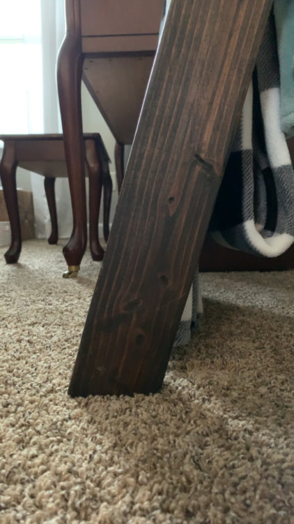 bottom view of blanket ladder, leaning against carpet