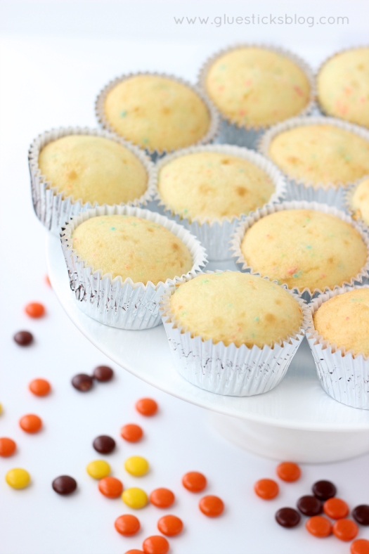 platter of unfrosted cupcakes