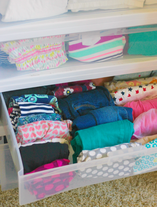 open drawers with organized clothes