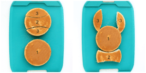 Yellow cake cut into a bunny shape.