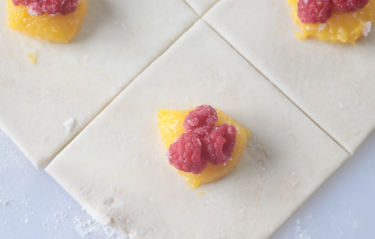 puff pastry dough with lemon curd and fresh raspberries