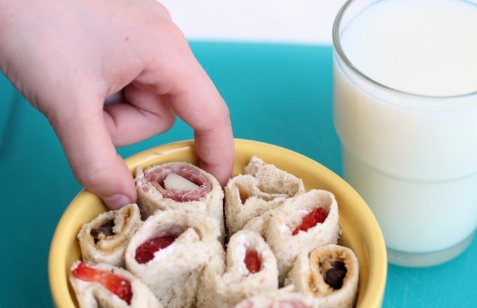 "Sushi" sandwich rolls ups are a quick and easy recipe for kids! A great intro to cutting skills and flavor combinations.