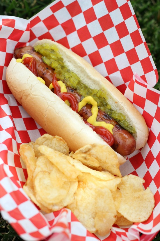 hot dog in basket with potato chips