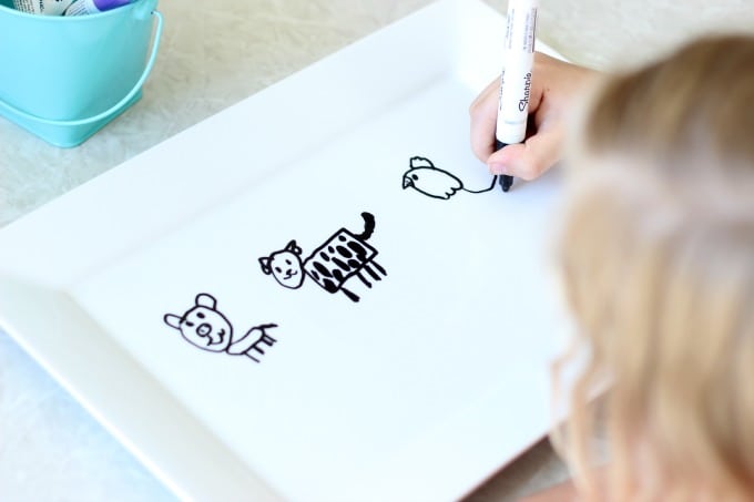 kids drawing on platter with oil based sharpie pens