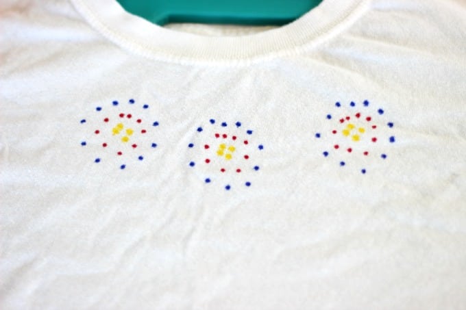 sharpie dots on a tshirt before adding rubbing alcohol