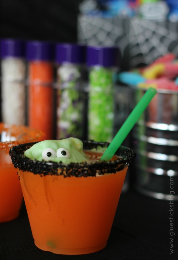 This little green monster Halloween punch is a show stopper! Sugar rimmed cups, a sherbet monster coming out of the punch cup, what more could you ask for? 