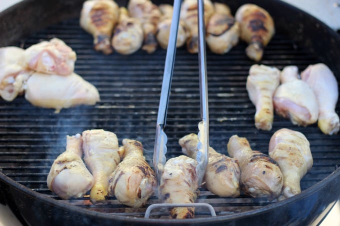 chicken on grill being turned over