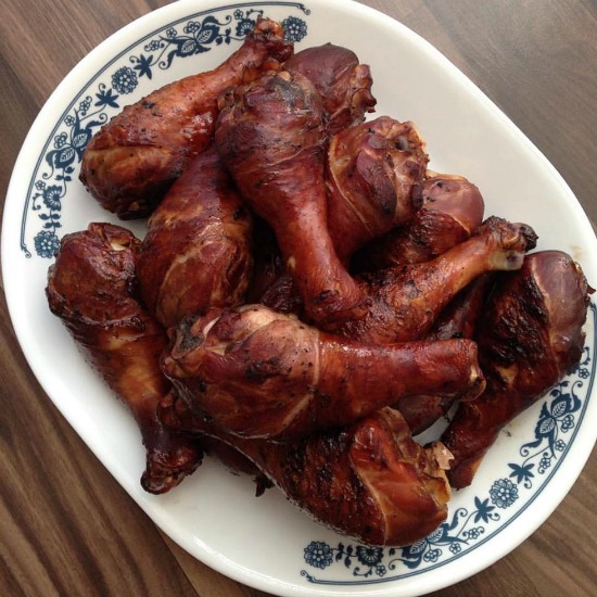 grilled chicken legs on a platter