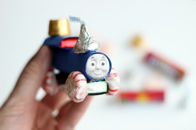 hand holding up thomas candy train