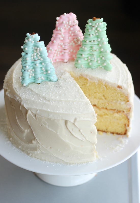 A deliciously moist vanilla cake filled with vanilla pudding sprinkled in sugar crystals and topped with white chocolate pretzel trees. 