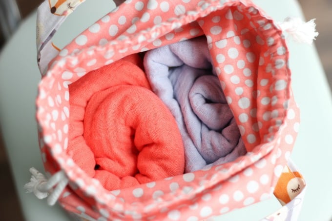 This cute fabric basket with an easy close drawstring can be used for things like toys, a mini diaper bag and more. It's a great baby shower gift!