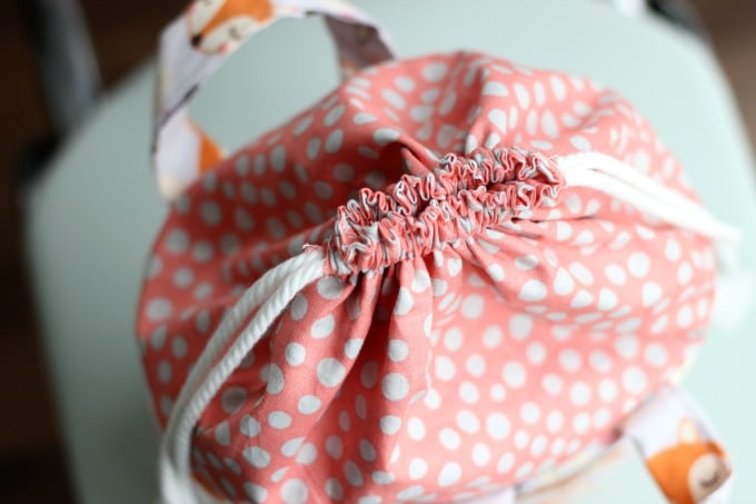This cute fabric basket with an easy close drawstring can be used for things like toys, a mini diaper bag and more. It's a great baby shower gift!