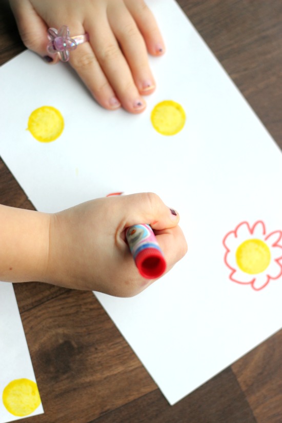 child coloring on plain white paper