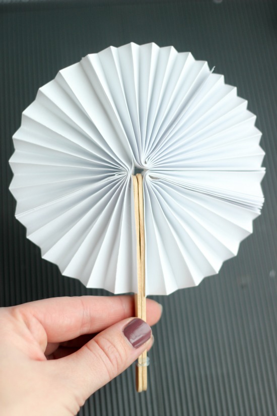 Paper fan shop with stick