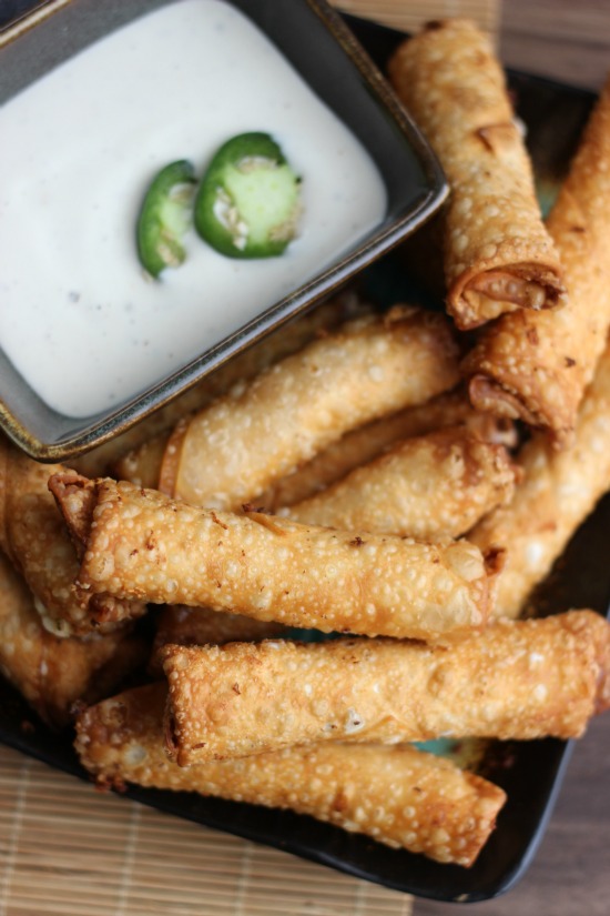 plate of jalapeño egg rolls and ramekin of ranch dressing