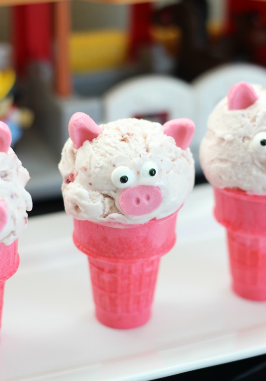 pink ice cream cones with scoops of pink ice cream and pig faces