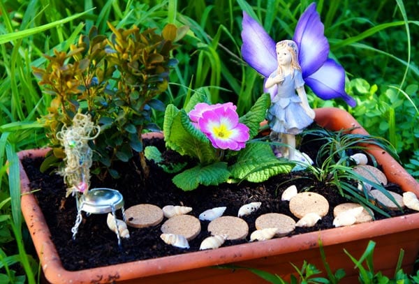 Winter, spring, summer and fall fairy garden inspiration to brighten your home and porch. Make one outdoor, indoors, with plants, with flowers, or with succulents! You can make it in a barrel, a milk jug, a pot, or a tea cup. 