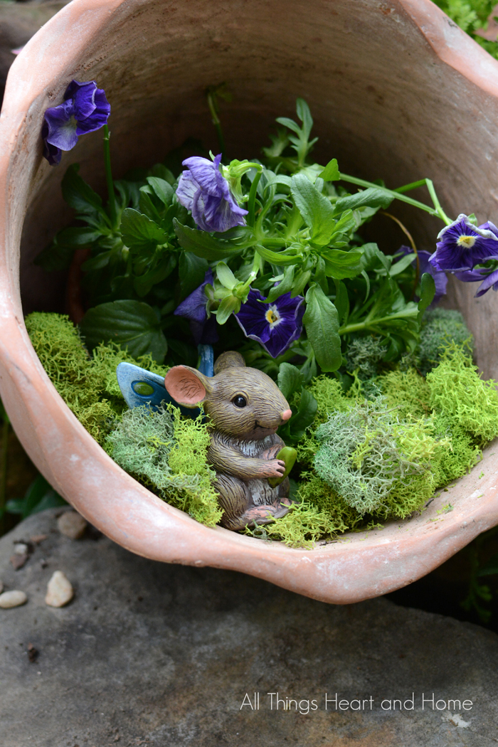 Winter, spring, summer and fall fairy garden inspiration to brighten your home and porch. Make one outdoor, indoors, with plants, with flowers, or with succulents! You can make it in a barrel, a milk jug, a pot, or a tea cup. 
