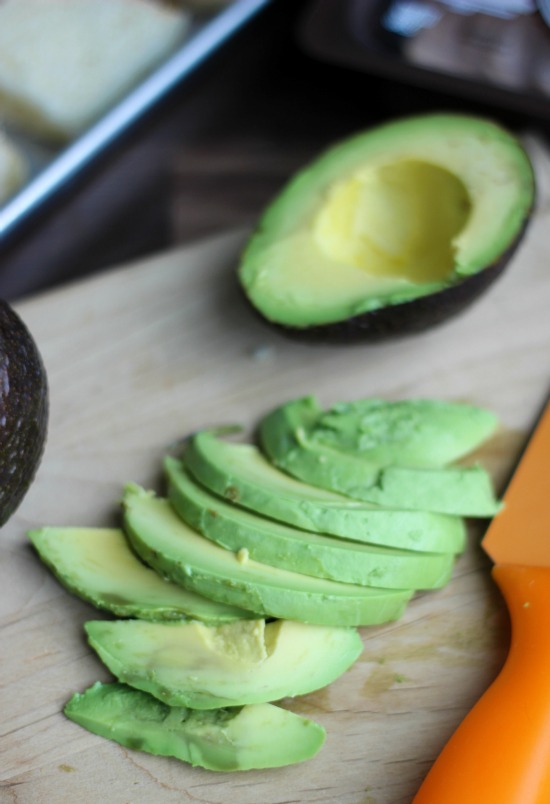 sliced avocado on cutting board