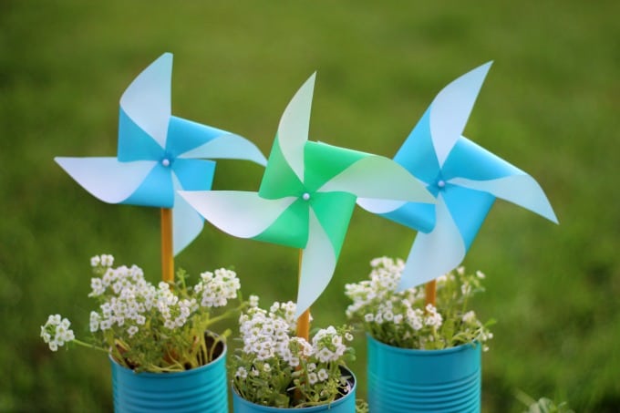 3 cans with flowers and pinwheels