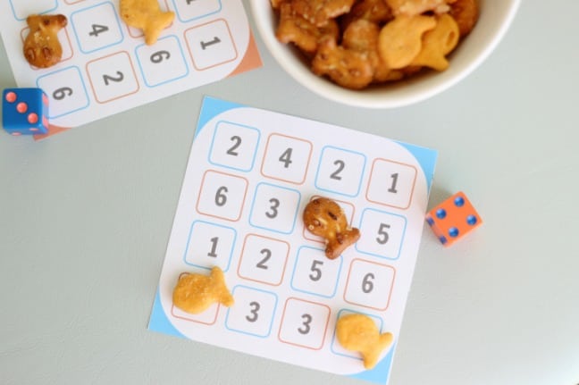 number dash game cards on table with dice