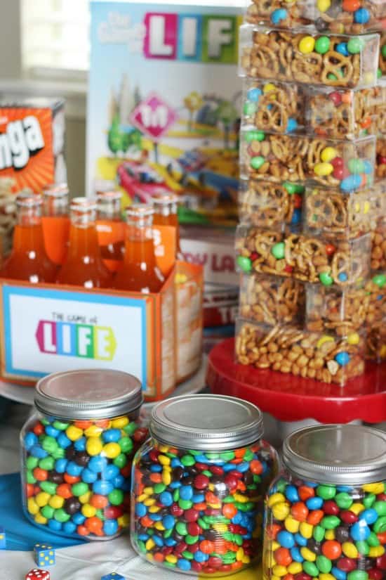 How to host THE BEST game night party. This family game night party includes everyone's favorite classic board games along with themed decor and treats! 3 jars of M&Ms