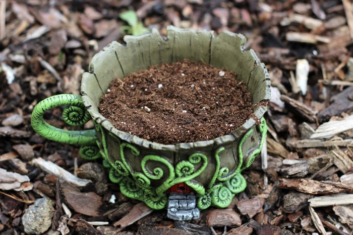 A whimsical fairy garden that will fit in the palm of your hand. This teacup fairy garden adds the perfect amount of magic to any windowsill or shelf!