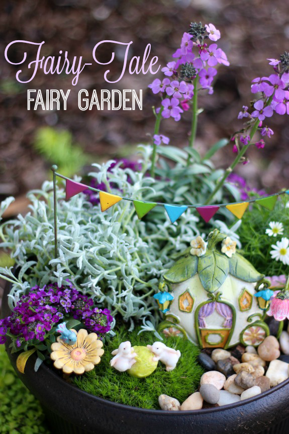 A darling fairy tale fairy garden, complete with a carriage! This little garden is what little girl dreams are made of. 