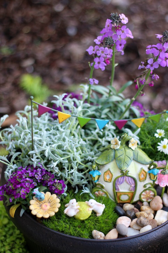 A darling fairy tale fairy garden, complete with a carriage! This little garden is what little girl dreams are made of. 