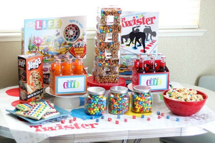 table with board games and game themed snacks