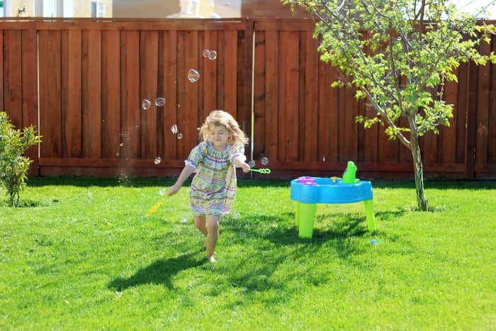 Make your own bubbles this summer with this 3 ingredient homemade bubble recipe. Simply combine water, dish soap, and glycerin! Fill up a large jug with homemade bubbles to have plenty on hand when spill happen, because they always do!