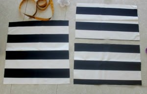 striped fabric pillow cover pieces next to measuring tape