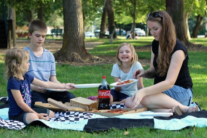 family having a picnic on bandanna picnic blanket