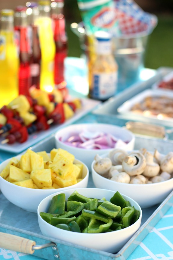 Summer Kebab Party! The perfect outdoor meal to enjoy with family and friends. Provide a variety of meats and veggies for guests to create their own kebabs and then grill to perfection. 