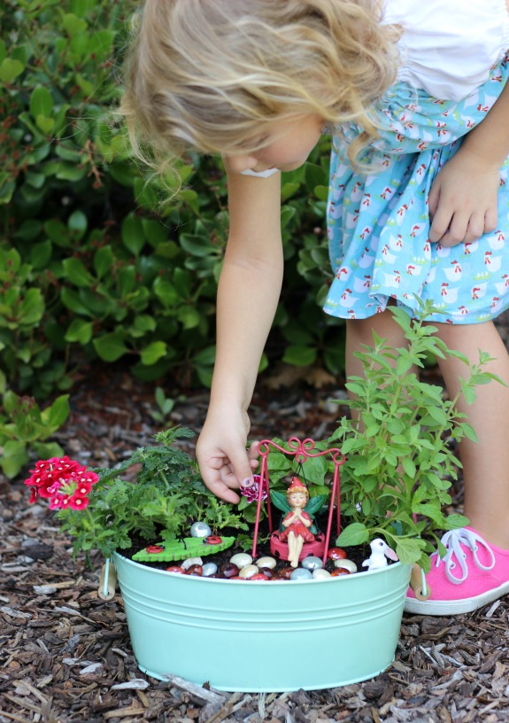 A kitchen herb fairy garden is as practical as it is pretty! Trim the leaves of the herbs off to use in recipes and watch the flowers bloom. Such a fun way to brighten up the kitchen.