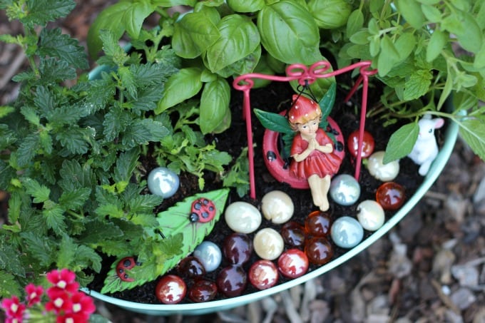 A kitchen herb fairy garden is as practical as it is pretty! Trim the leaves of the herbs off to use in recipes and watch the flowers bloom. Such a fun way to brighten up the kitchen.