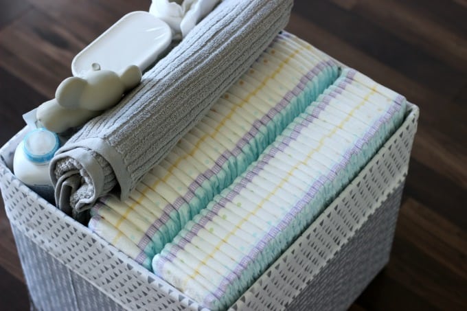 Turn a diaper box into a storage tote for a nursery. The perfect way to store everything to make diaper changing time a breeze! 