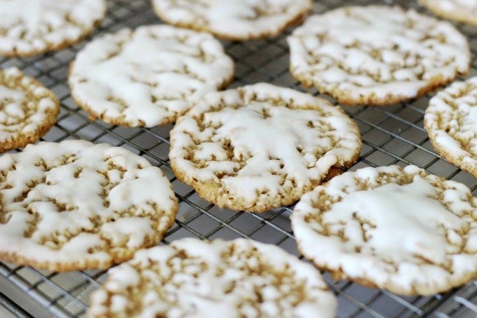 iced oatmeal cookies on cooling rack