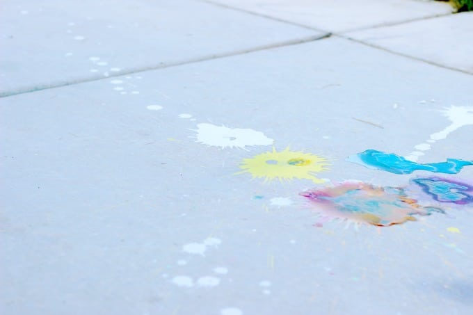 A science experiment, crowd pleaser, and boredom buster all in one! These sidewalk paint rockets splatter colorful bursts of chalk paint on the ground and clean up with water!