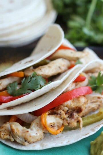 two fajitas on plate with guacamole